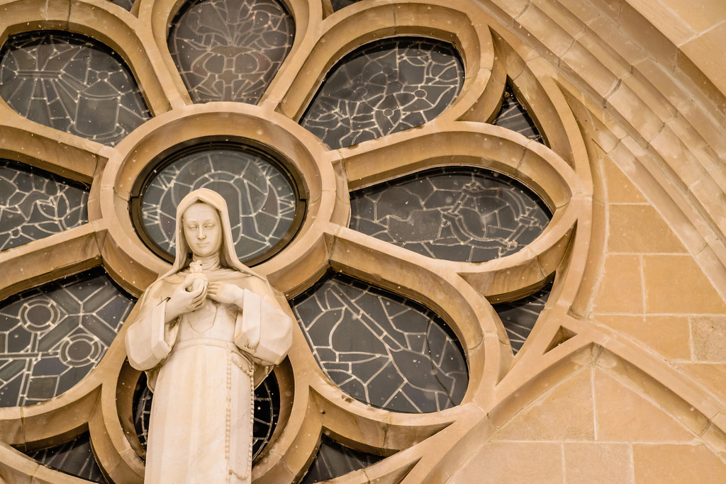 Stained Glass Window with Madonna Statue