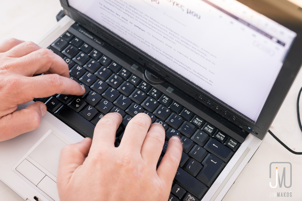 Woman typing on a keyboard.