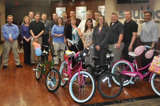 Employees of Southco build bikes