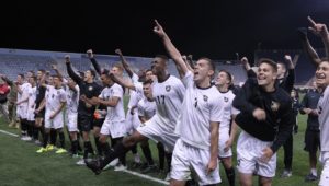 The Army men's soccer team salutes fellow cadets.