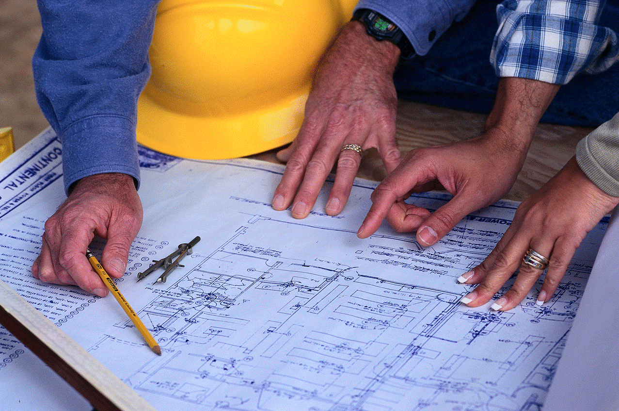Contractors looking at a blueprint