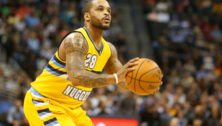 Jameer Nelson with a basketball ready to shoot.