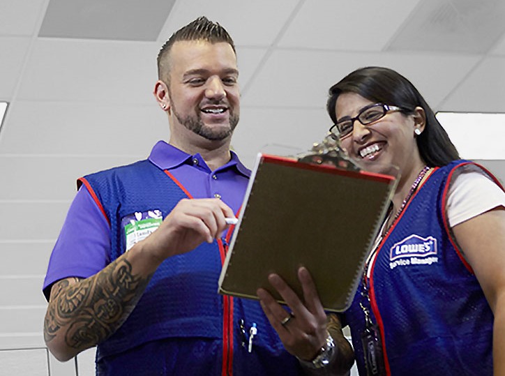 A man and a woman employee at Lowe's.