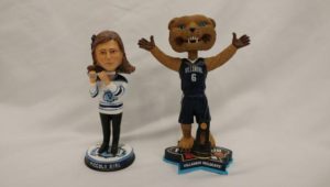 The Piccolo Girl and Will D. Cat bobbleheads