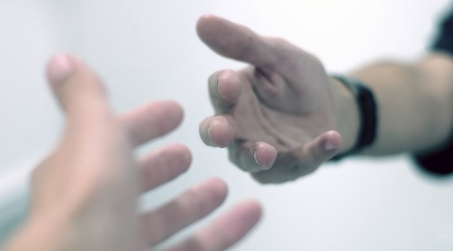 Two hands reaching out