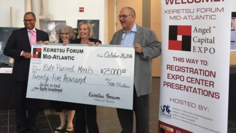 Representatives of West Chester University and Elite Pureed Foods hold the winning check in the 2016 Annual Business Idea Competition.