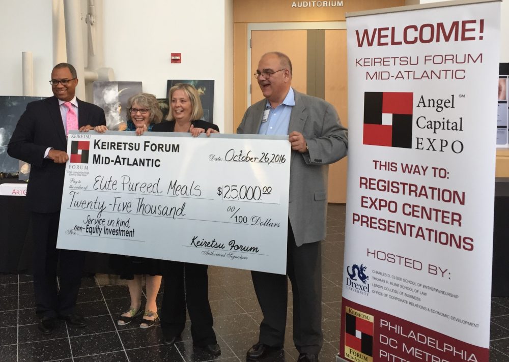 Representatives of West Chester University and Elite Pureed Foods hold the winning check in the 2016 Annual Business Idea Competition.