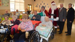 Delaware County Council members, Santa Claus and veterans at Fair Acres enjoy a holiday party.