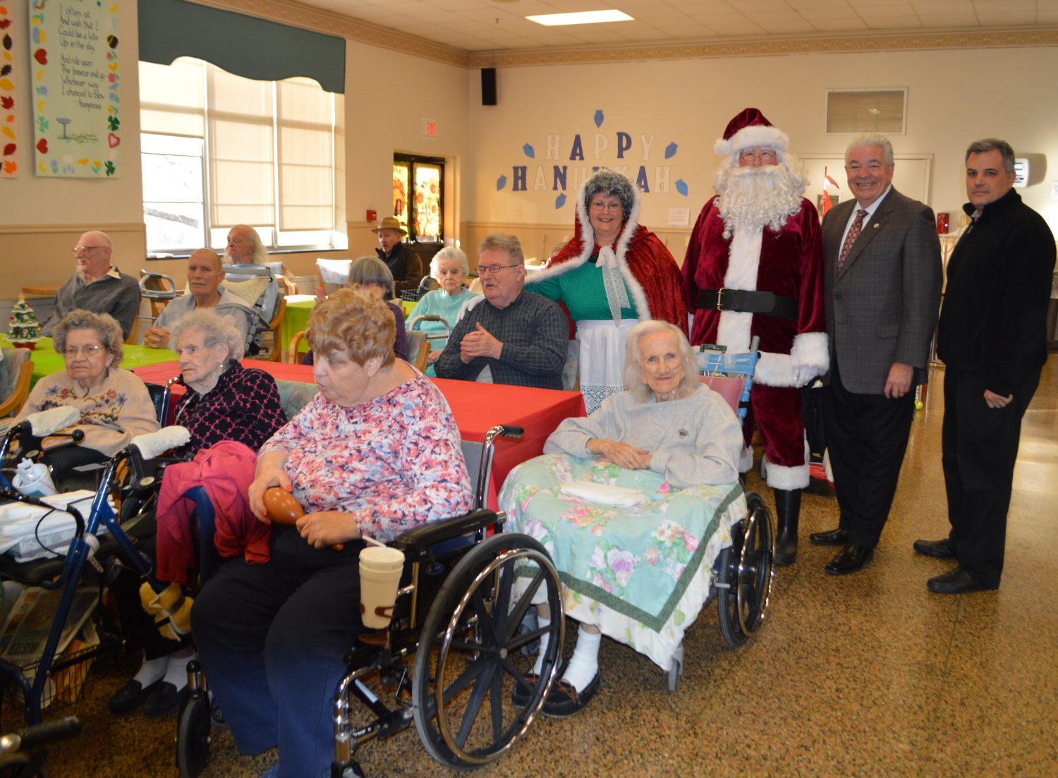 Delaware County Council members, Santa Claus and veterans at Fair Acres enjoy a holiday party.