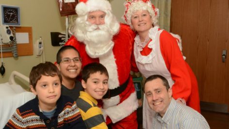 Santa and Mrs. Claus pay a visit to families on the oncology floor at the Hospital of the University of Pennsylvania.