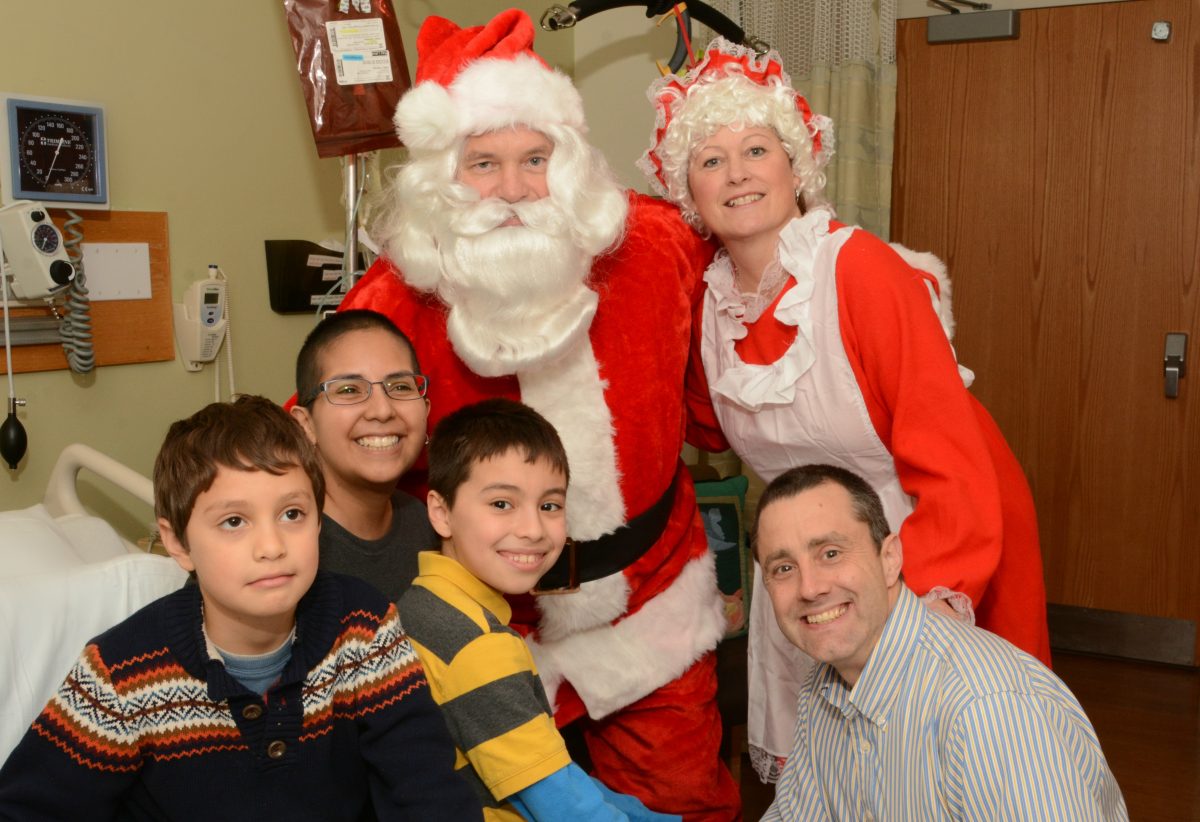 Santa and Mrs. Claus pay a visit to families on the oncology floor at the Hospital of the University of Pennsylvania.