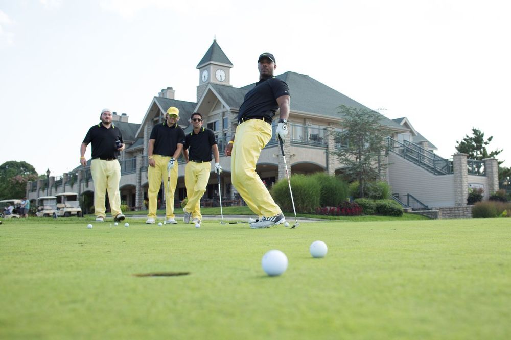 A group plays some golf at Power Home Remodeling.
