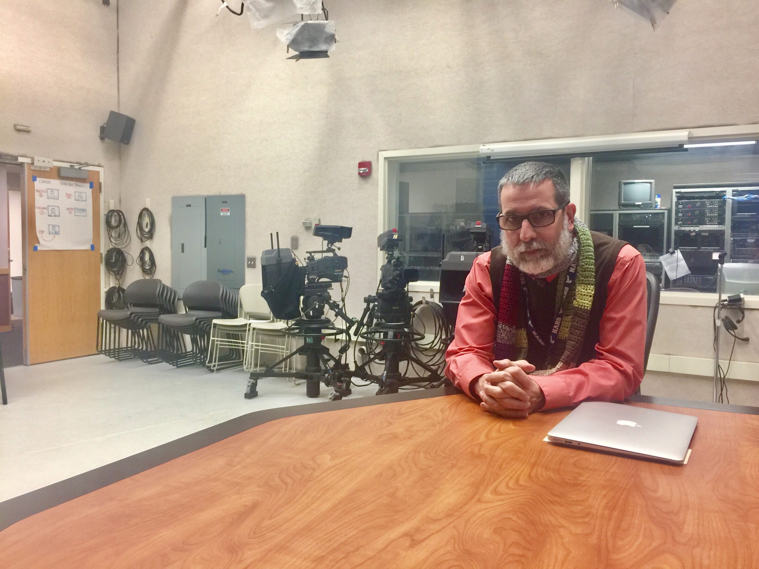 John Doyle sitting at a table.