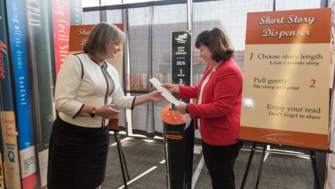 A woman has her ticket checked at a Philadelphia International Airport gate.