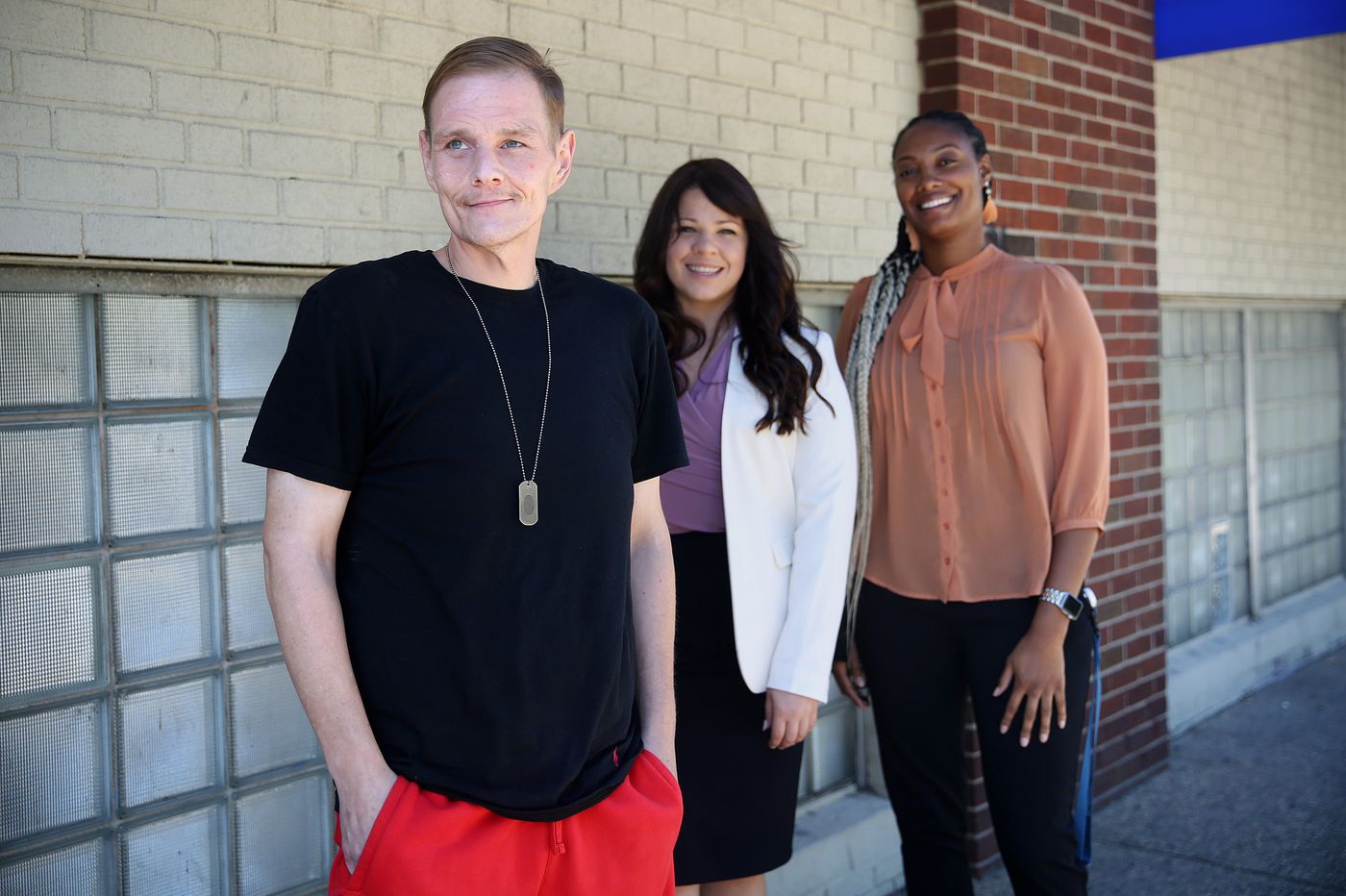 Three participants in the Recovery Through Work program.