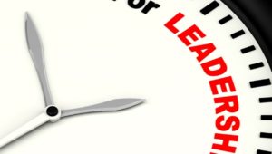 A graphic of a clock with the words "Time for Leadership".