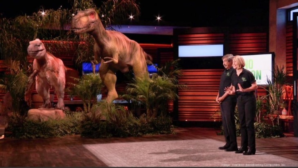 Don Lessem and Valerie Jones share the Shark Tank stage with two robotic dinosaurs
