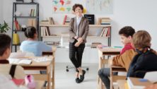 Teacher Pauses in front of a classroom