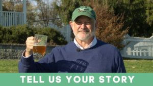 Glen Macnow holding a beer, promoting the WIP radio segment 'Tell Us Your Story."