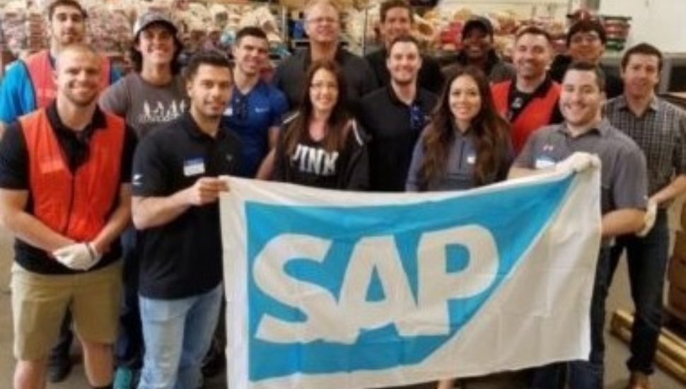SAP employees with a banner at the Newtown Square headquarters