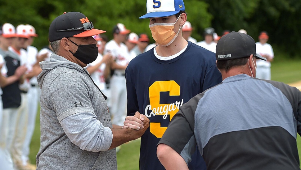 Marple Newtown and Strath Haven head coaches Rick Zimmerman, left, and Brian Fili greet Springfield's A.J. Grande.