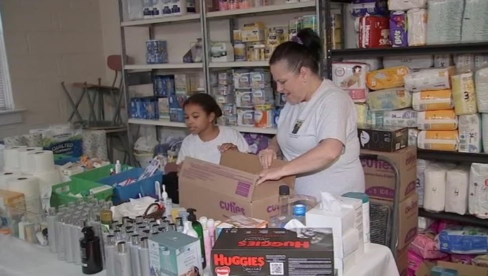 Karen Barnes with her granddaughter at Denis' Pantry.