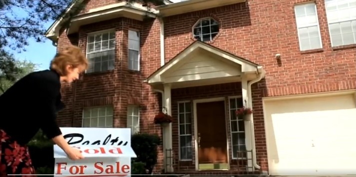 Sign outside home is changed from "for sale" to "sold".