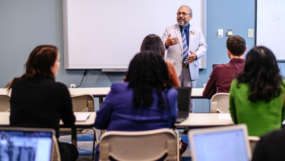 A professor teaches a class at Neumann University. A leadership certificate is now offered.