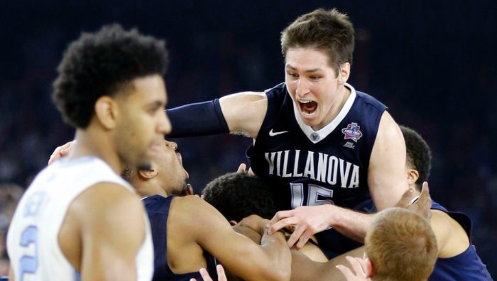 Villanova's Ryan Arcidiacono (top, right) and teammates celebrate Kris Jenkins' win in 2016 NCAA title game.