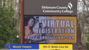 The Delaware County Community College billboard outside its Marple campus. College vaccinations are being implemented at local universities.