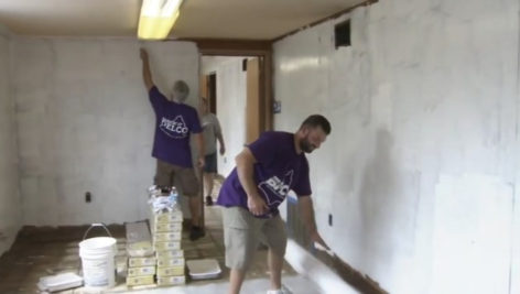 Volunteer employees from BHCU credit union get a warehouse in shape for Teachers Teammates.