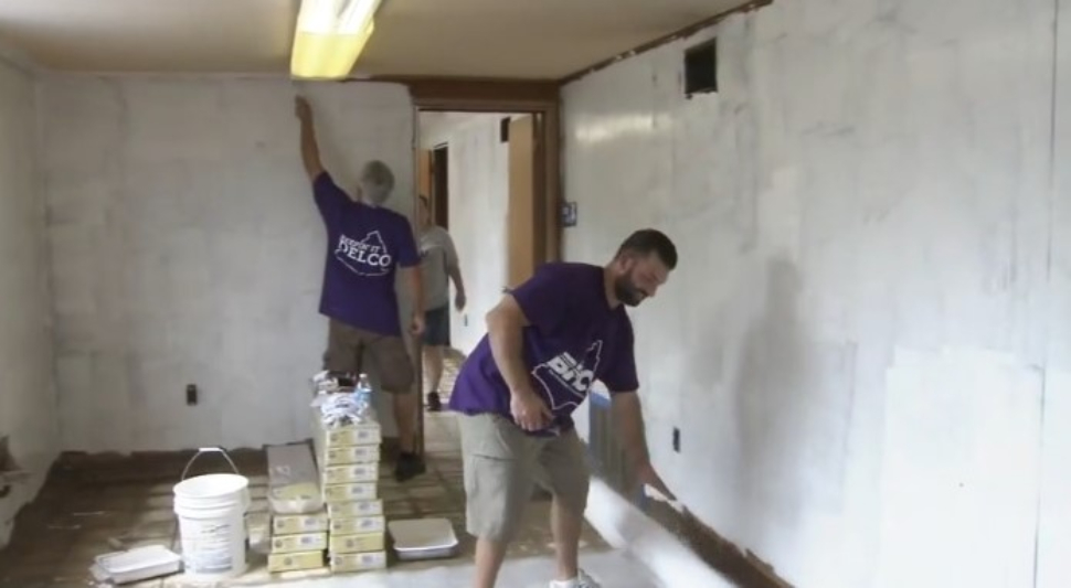Volunteer employees from BHCU credit union get a warehouse in shape for Teachers Teammates.