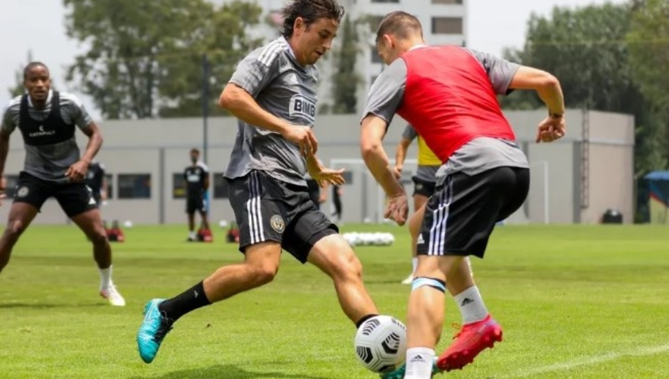 A Philadelphia Union player gets into the mix with a Club America player at Azteca stadium in Mexico. Union coach Jim Curtin appreciated the opportunity for the team to play.