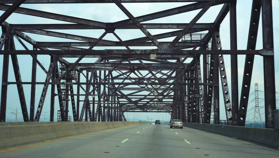 Cars traveling over a bridge that would be eligible for funds from the infrastructure bill.