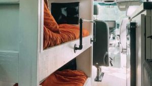 Bunk beds and more in this custom camper van can accommodate an entire family.