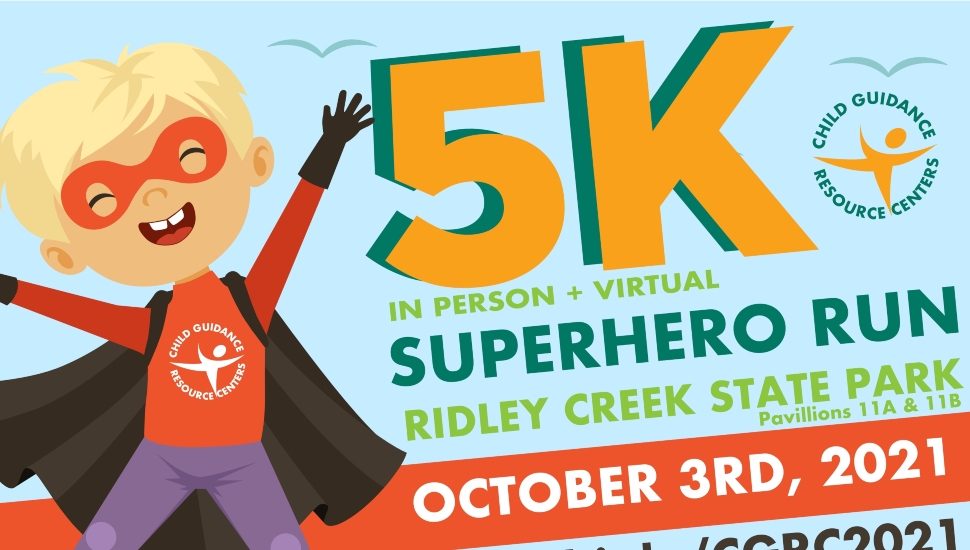 A sign promoting Child Guidance Resource Centers Superhero 5K.