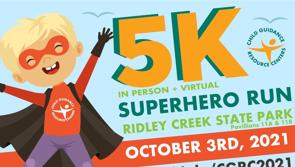 A sign promoting Child Guidance Resource Centers Superhero 5K.