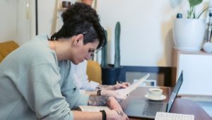 Woman works remotely at her home office in a job market that gives workers more say in their job descriptions.