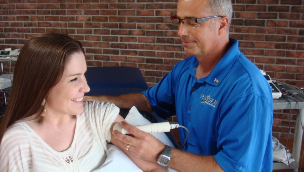 A diagnostic medical sonographer performs an ultrasound on a patient.
