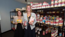 Rina Keller and Mary Beth Davis stand in the Knights' Pantry, a new food pantry for students at Neumann University