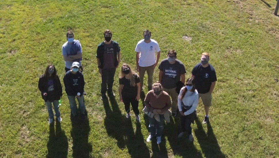 Aerial shot of GEV students with a drone at Willow Creek Farm Preserve.