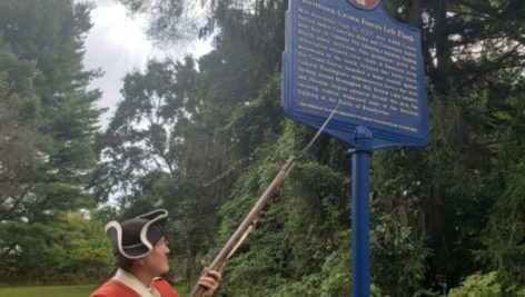 Randall Spackman points to a historic marker in Westtown.