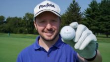 Gavin Perrett holds up a Penfold golf ball.