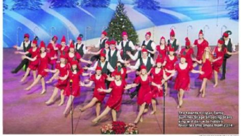 The Upper Darby Shooting Stars perform holiday songs on stage.