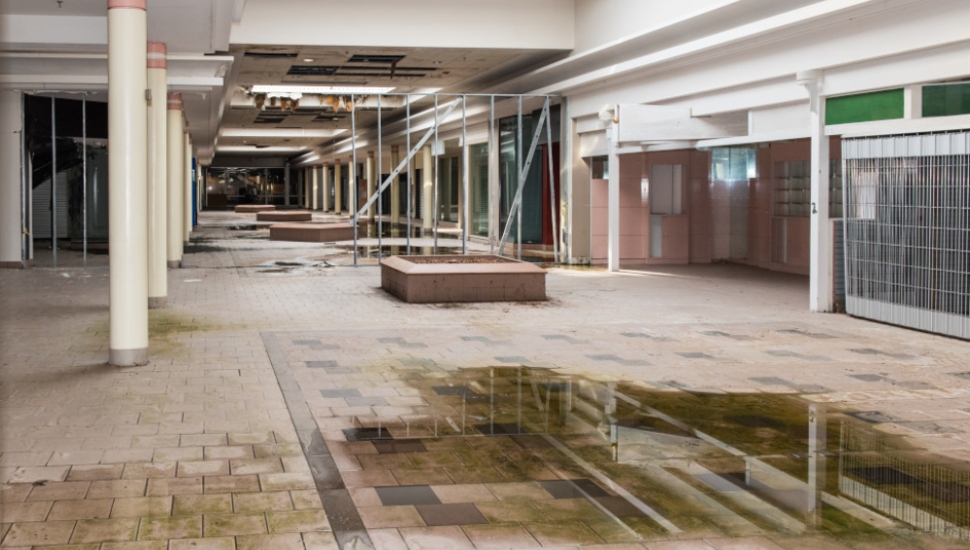 abandoned corridor with water on the floor