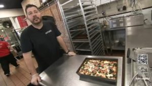 Nick Haselidis with his Santorini pizza.