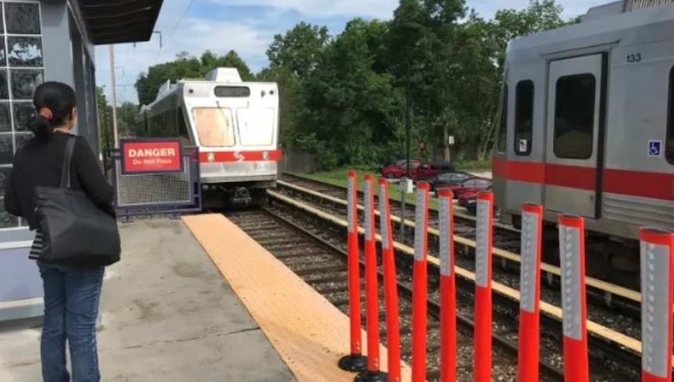 A Norristown High Speed Line car arrives at a station near Wynnewood.