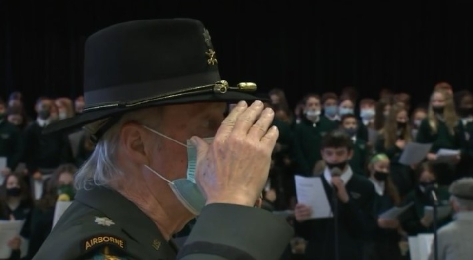 A veteran stands and salutes at St. Dorothy's School in Drexel Hill as the song for his branch of the service is sung on Veterans Day.