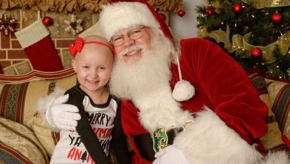 Brynlee with Santa helper Kevin Chesney.