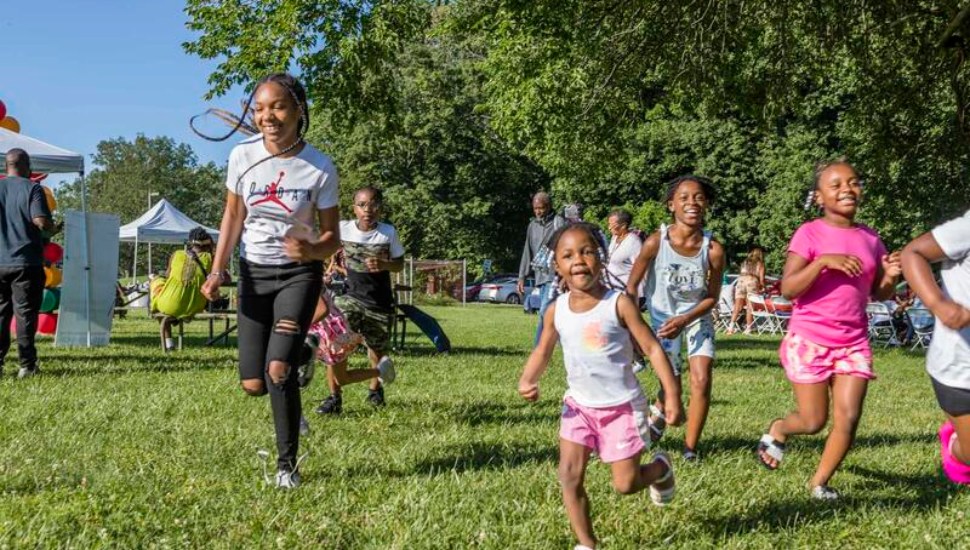 Children running on a lawn